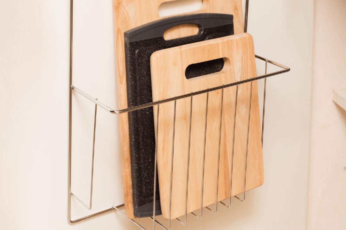 Cutting boards stored upright in a wire rack